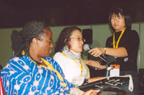A lot of women sitting in a plenary meeting